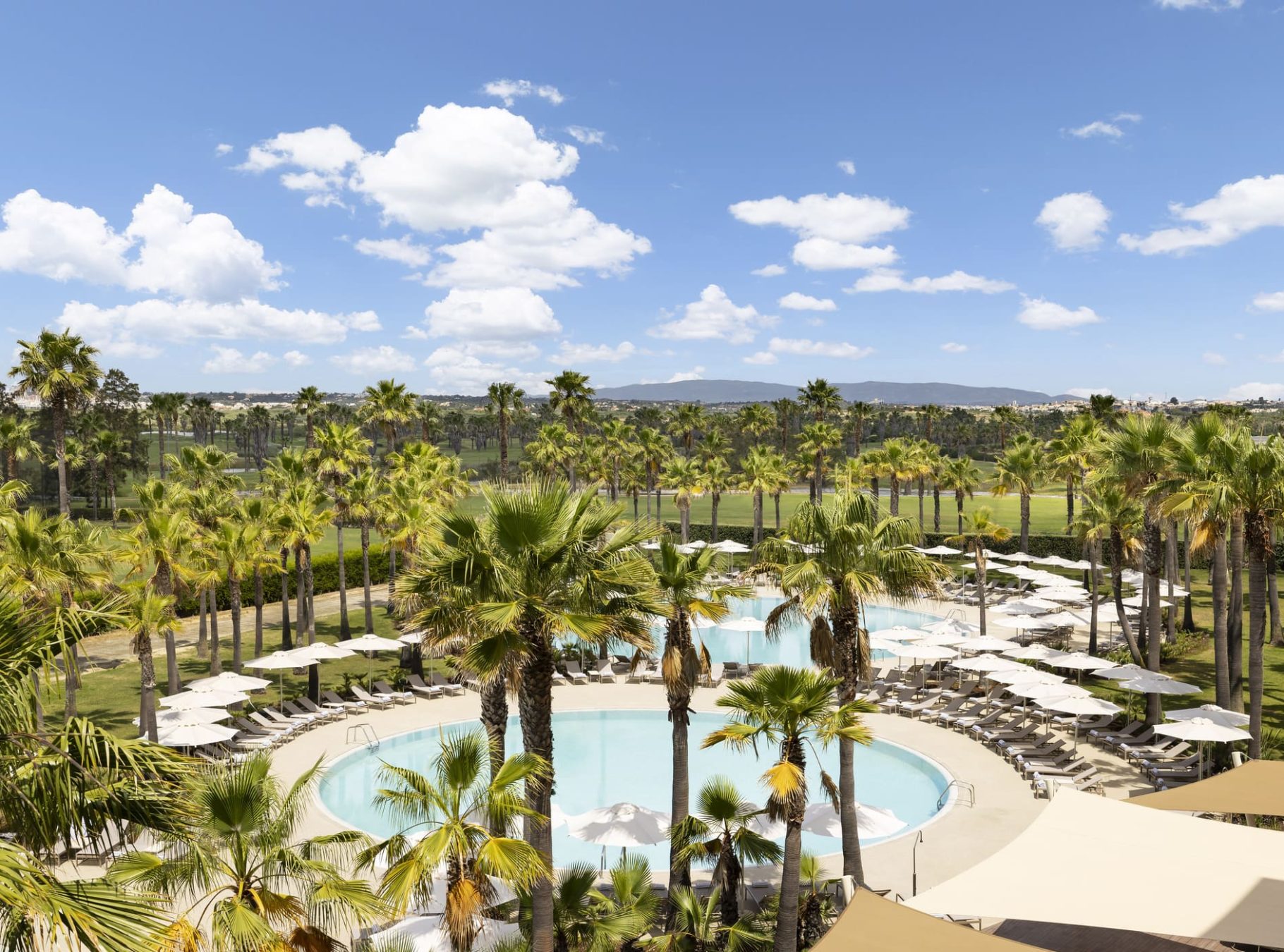 Outdoow pools featuring salgados golf course views at the Algarve Marrriott Salgados Golg Resort and Spa
